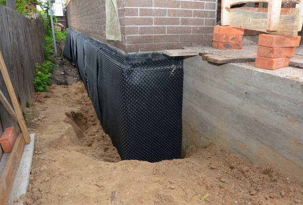Happy homeowners after waterproofing job in Helenwood